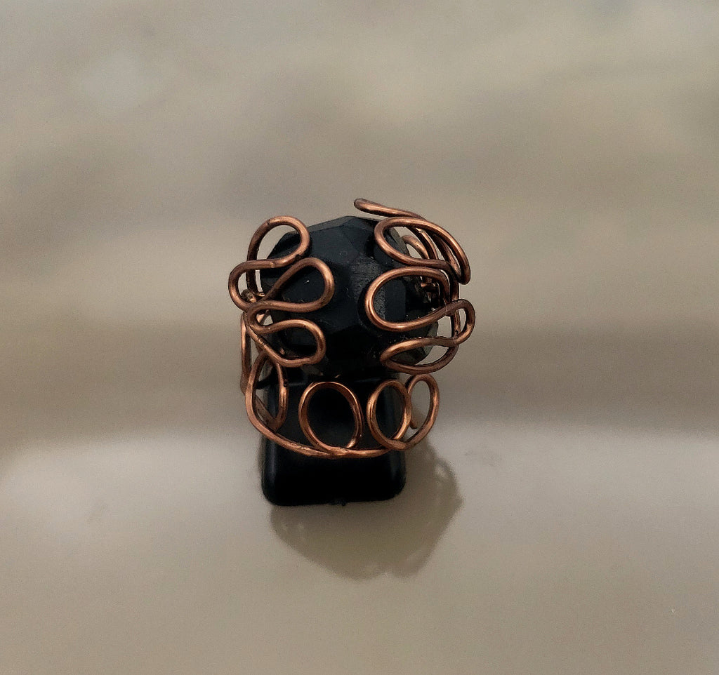 Black spinel statement ring wrapped in hand-formed antiqued copper wire