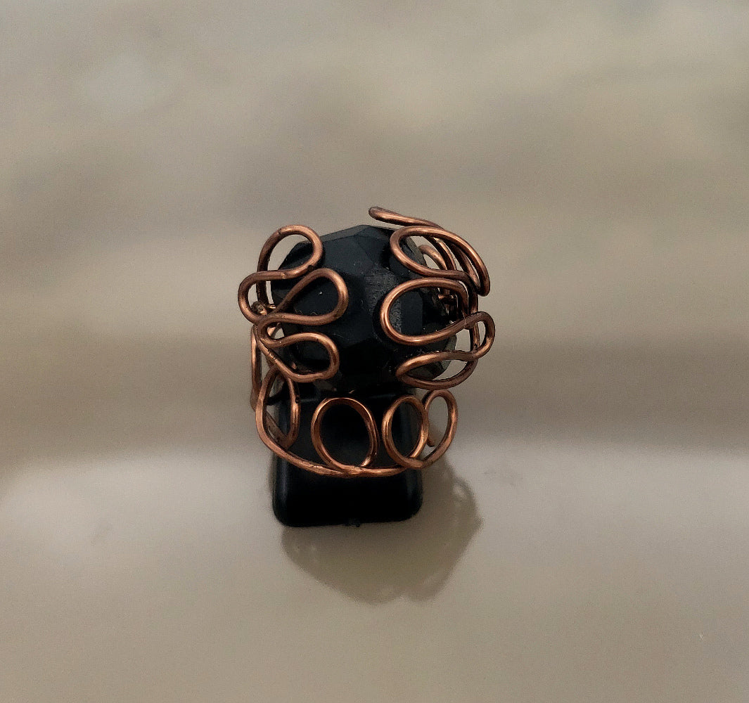 Black spinel statement ring wrapped in hand-formed antiqued copper wire