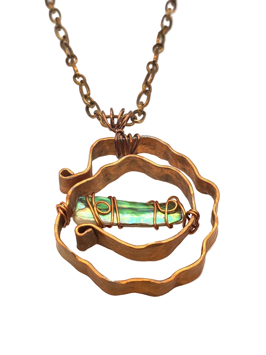 Angled view of Abalone Shell Necklace handcrafted with antiqued copper and sculptural detail. 