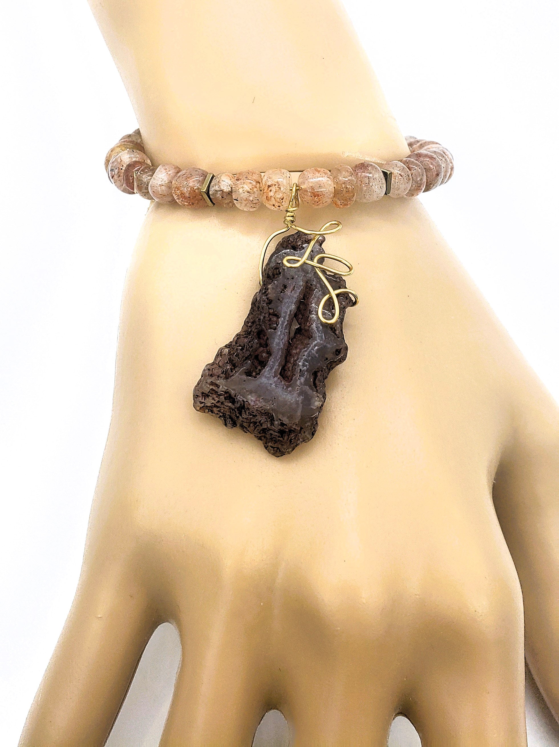 Aventurine and lace agate bracelet shown worn with a natural stone pendant and brass wire detailing