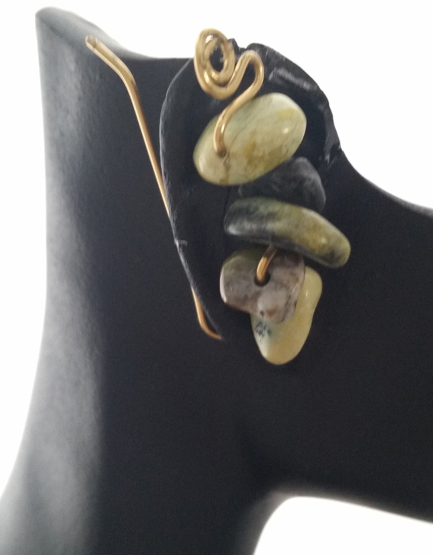 Worn view of Grass Turquoise Vine Earrings handcrafted in natural brass, with sculptural wirework designed to wear as an ear climber or elegant dangle.
