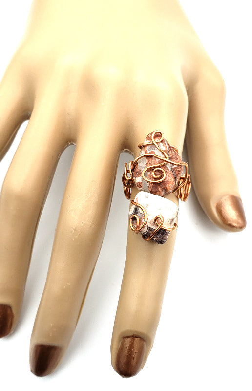 Adjustable lace agate statement ring with copper wire worn on the hand
