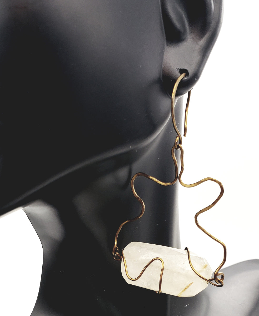 Worn view of Rutilated Quartz Earrings handcrafted in antiqued brass, featuring natural golden inclusions and sculptural wirework.