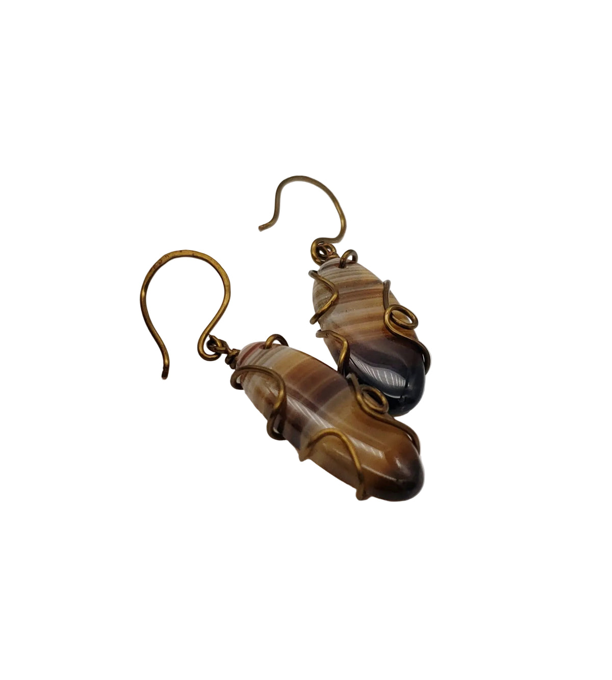 Striped agate wire-wrapped earrings with natural banded gemstones and antiqued brass wire on a white background